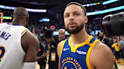 Dec 25, 2024; San Francisco, California, USA; Golden State Warriors guard Stephen Curry (30) stands on the court after greeting Los Angeles Lakers forward LeBron James (left) after the game at Chase Center. Mandatory Credit: Darren Yamashita-Imagn Images