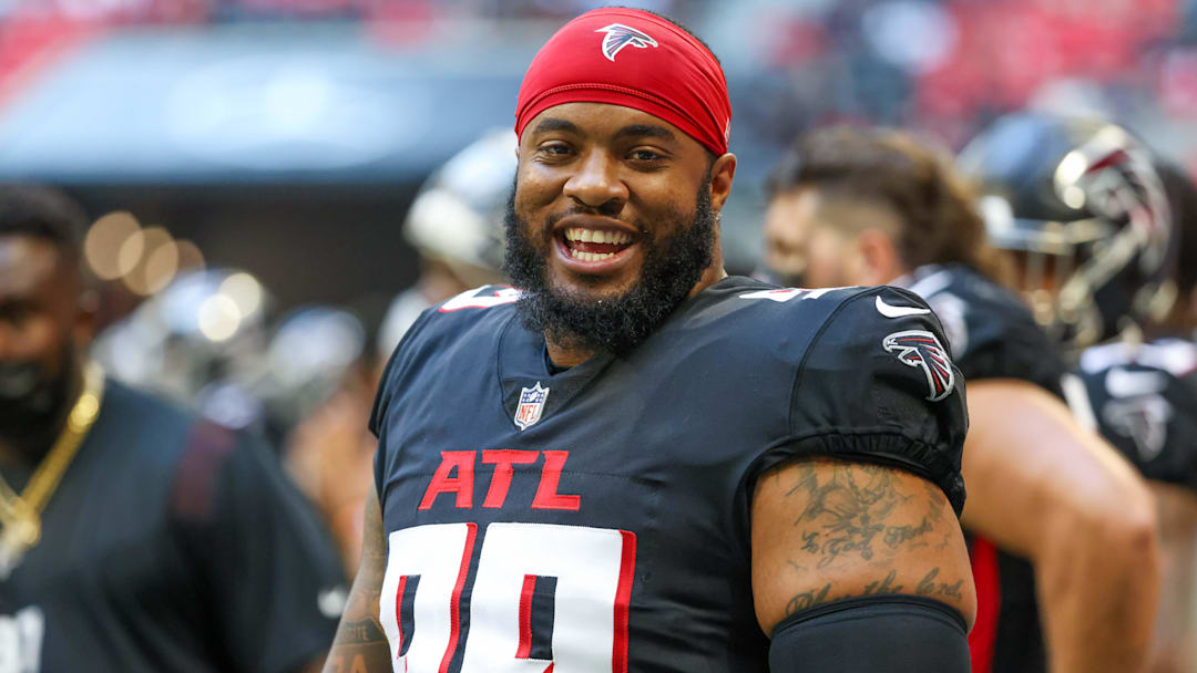 Aug 13, 2021; Atlanta, Georgia, USA; Atlanta Falcons defensive end Jonathan Bullard (99) talks with teammates on the sideline during their game against the Tennessee Titans at Mercedes-Benz Stadium. Mandatory Credit: Jason Getz-Imagn Images