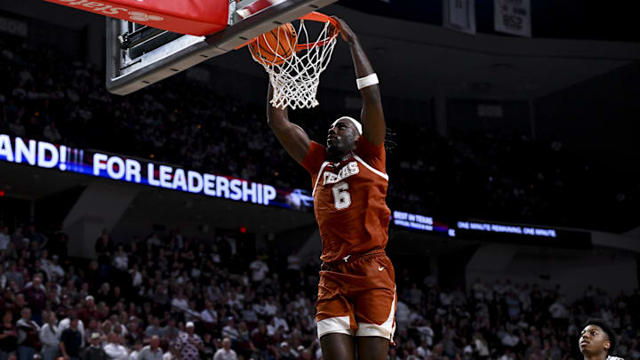 Jan 4, 2025; College Station, Texas, USA; Texas Longhorns forward Arthur Kaluma (6) slam dunks the ball during the second half against the Texas A&M Aggies.