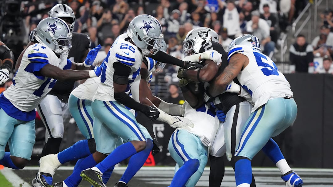 Nov 17, 2025; Paradise, Nevada, USA; Las Vegas Raiders running back Ashton Jeanty (2) is tackled by Dallas Cowboys defensive end Sam Williams (54) for a safety during the second half at Allegiant Stadium. Mandatory Credit: Kirby Lee-Imagn Images