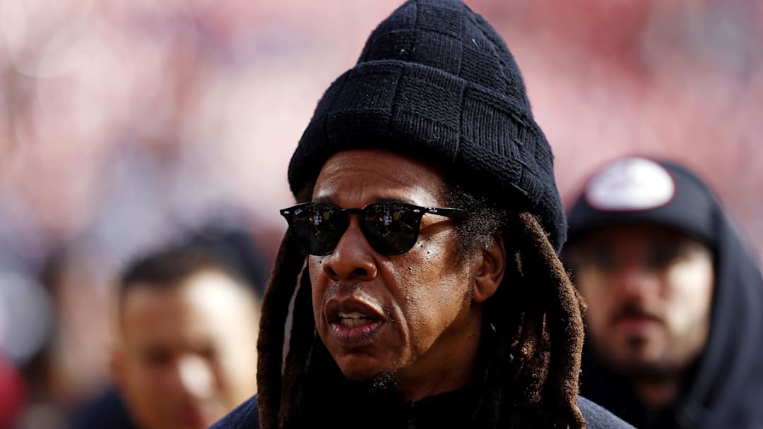 Jay-Z walks on the field before a game