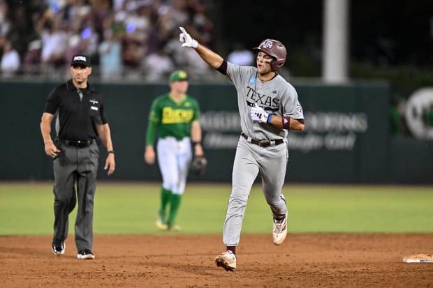 exas A&M infielder Kaeden Kent (3) hits a grand slam in the top of the seventh inning against Oregon at Olsen Field.