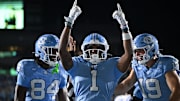 Nov 22, 2025; Chapel Hill, North Carolina, USA; North Carolina Tar Heels wide receiver Jordan Shipp (1) celebrates after a touchdown during the second half at Kenan Stadium. Mandatory Credit: William Howard-Imagn Images