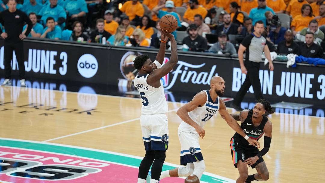 May 4, 2026; San Antonio, Texas, USA; Minnesota Timberwolves guard Anthony Edwards (5) shoots in front of San Antonio Spurs guard Devin Vassell (24) in the second half during game one of the second round of the 2026 NBA Playoffs at Frost Bank Center. Mandatory Credit: Daniel Dunn-Imagn Images