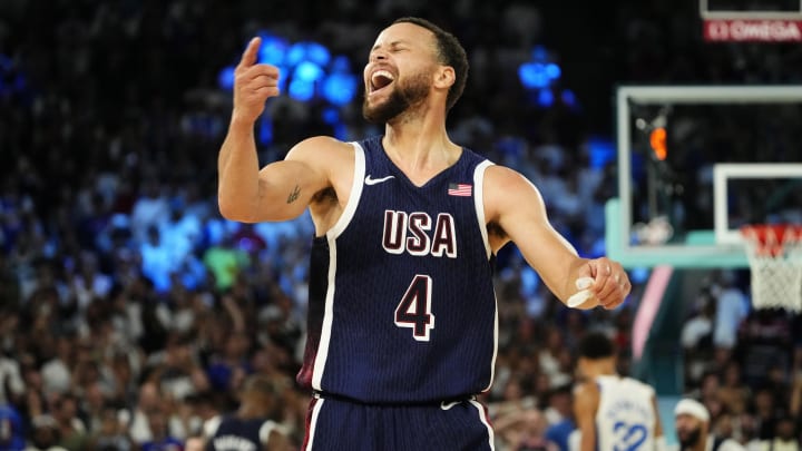 United States shooting guard Stephen Curry (4) celebrates after defeating France in the men's basketball gold medal game during the Paris 2024 Olympic Summer Games at Accor Arena. Mandatory Credit: