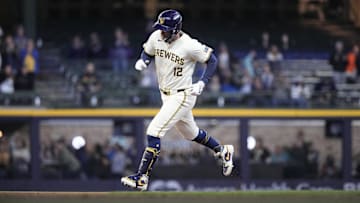 May 9, 2024; Milwaukee, Wisconsin, USA;  Milwaukee Brewers first baseman Rhys Hoskins (12) rounds the bases after hitting a home run during the first inning against the St. Louis Cardinals at American Family Field. Mandatory Credit: Jeff Hanisch-USA TODAY Sports