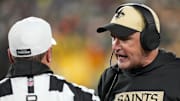 Dec 23, 2024; Green Bay, Wisconsin, USA;  New Orleans Saints head coach Darren Rizzi argues with referee Alex Kemp (55) during the first quarter against the Green Bay Packers at Lambeau Field. Mandatory Credit: Jeff Hanisch-Imagn Images