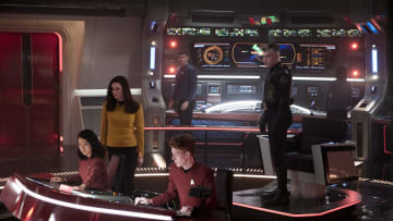 L-R Rong Fu as Mitchell, Rebecca Romijn as Una, Ethan Peck as Spock and Anson Mount as Capt. Pike in Star Trek: Strange New Worlds streaming on Paramount+, 2023. Photo Credit: Michael Gibson/Paramount+