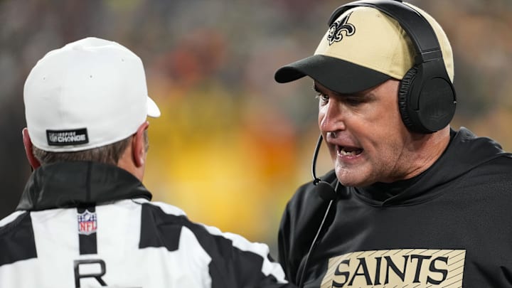 New Orleans Saints head coach Darren Rizzi argues with referee Alex Kemp (55) during the first quarter against the Green Bay Packers at Lambeau Field. New Orleans Saints head coach Darren Rizzi argues with referee Alex Kemp (55) during the first quarter against the Green Bay Packers at Lambeau Field.