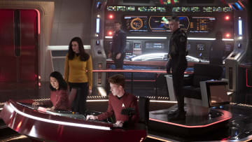 L-R Rong Fu as Mitchell, Rebecca Romijn as Una, Ethan Peck as Spock and Anson Mount as Capt. Pike in Star Trek: Strange New Worlds streaming on Paramount+, 2023. Photo Credit: Michael Gibson/Paramount+