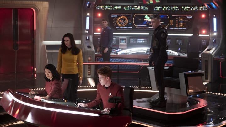 L-R Rong Fu as Mitchell, Rebecca Romijn as Una, Ethan Peck as Spock and Anson Mount as Capt. Pike in Star Trek: Strange New Worlds streaming on Paramount+, 2023. Photo Credit: Michael Gibson/Paramount+