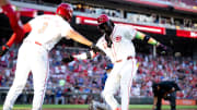 Cincinnati Reds shortstop Elly De La Cruz (44) celebrates with Cincinnati Reds third baseman Jeimer Candelario (3) after hitting a 3-run home run to take a one run lead in the third inning of the MLB game against the Chicago Cubs at Great American Ball Park in Cincinnati on Thursday, June 6, 2024.