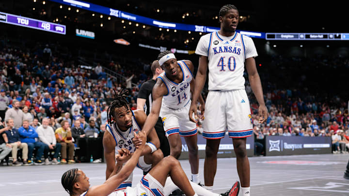 Mar 12, 2026; Kansas City, MO, USA; Kansas Jayhawks help up guard Elmarko Jackson (13) during the second half of the game against the TCU Horned Frogs at T-Mobile Center. Mandatory Credit: William Purnell-Imagn Images