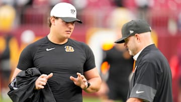 Cincinnati Bengals defensive end Trey Hendrickson (91) talks with director of player personnel Duke Tobin before the first quarter of the NFL Preseason Week 2 game between the Washington Commanders and the Cincinnati Bengals at Northwest Stadium in Landover, Md., on Monday, Aug. 18, 2025.