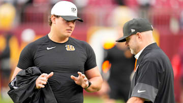 Cincinnati Bengals defensive end Trey Hendrickson (91) talks with director of player personnel Duke Tobin before the first quarter of the NFL Preseason Week 2 game between the Washington Commanders and the Cincinnati Bengals at Northwest Stadium in Landover, Md., on Monday, Aug. 18, 2025.