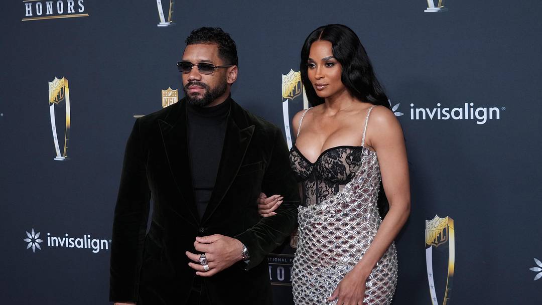 Russell Wilson (left) and wife Ciara pose on the NFL Honors Red Carpet before Super Bowl LX at Palace of Fine Arts. Mandatory Credit: Kirby Lee-Imagn Images.