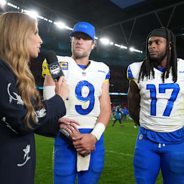 Oct 19, 2025; London, United Kingdom; NFL Network reporter Sara Walsh (left) interviews Los Angeles Rams quarterback Matthew Stafford (9) and wide receiver Davante Adams (17) after a NFL International Series game against the Jacksonville Jaguars at Wembley Stadium. Mandatory Credit: Kirby Lee-Imagn Images