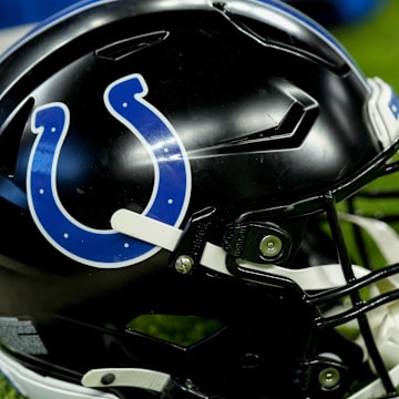 A black Indianapolis Colts helmet sits on the turf Sunday, Nov. 24, 2024, during a game against the Detroit Lions at Lucas Oil Stadium in Indianapolis.
