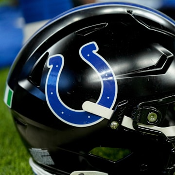 A black Indianapolis Colts helmet sits on the turf Sunday, Nov. 24, 2024, during a game against the Detroit Lions at Lucas Oil Stadium in Indianapolis.
