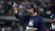 Dallas head coach Brian Schottenheimer gestures on the sideline against the Las Vegas Raiders 