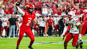 Aug 28, 2025; Kansas City, Missouri, USA; Cincinnati Bearcats quarterback Brendan Sorsby (2) passes against Nebraska Cornhuskers defensive lineman Keona Davis (97) during the second quarter at GEHA Field at Arrowhead Stadium. Mandatory Credit: Dylan Widger-Imagn Images
