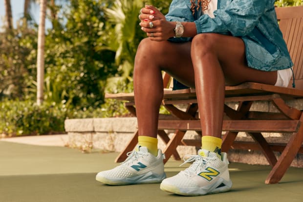 Coco Gauff's white and green New Balance tennis shoes.