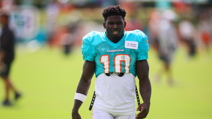 Aug 6, 2024; Miami Gardens, FL, USA; Miami Dolphins wide receiver Tyreek Hill (10) looks on during a joint practice with the Atlanta Falcons at Baptist Health Training Complex. Mandatory Credit: Sam Navarro-USA TODAY Sports