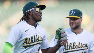 Jul 23, 2024; Oakland, California, USA;  Oakland Athletics outfielder Lawrence Butler (4) smiles alongside outfielder Seth Brown (15) during the first inning against the Houston Astros at Oakland-Alameda County Coliseum. Mandatory Credit: Stan Szeto-USA TODAY Sports