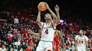 Feb 23, 2025; Piscataway, New Jersey, USA; Rutgers Scarlet Knights guard Ace Bailey (4) shoots the ball while being defended by USC Trojans guard Bryce Pope (4) during the second half at Jersey Mike's Arena. Mandatory Credit: John Jones-Imagn Images