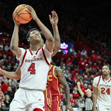 Feb 23, 2025; Piscataway, New Jersey, USA; Rutgers Scarlet Knights guard Ace Bailey (4) shoots the ball while being defended by USC Trojans guard Bryce Pope (4) during the second half at Jersey Mike's Arena. Mandatory Credit: John Jones-Imagn Images