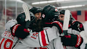 The Ohio State women's hockey team celebrates a goal early in the 2025 season.