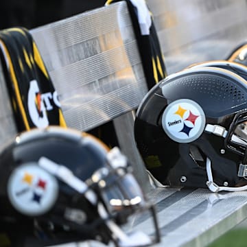 Aug 9, 2024; Pittsburgh, Pennsylvania, USA;  Pittsburgh Steelers helmets sit on the bench during the 3rd quarter against the Houston Texans at Acrisure Stadium. Mandatory Credit: Barry Reeger-Imagn Images