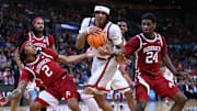 Mar 22, 2025; Providence, RI, USA: Arkansas Razorbacks guard Boogie Fland (2) and forward Billy Richmond III (24) fight for a rebound against St. John's Red Storm guard Aaron Scott (0) during the second half of a second round men’s NCAA Tournament game at Amica Mutual Pavilion. Mandatory Credit: Brian Fluharty-Imagn Images