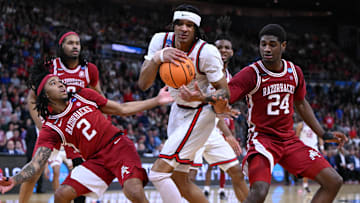 Mar 22, 2025; Providence, RI, USA: Arkansas Razorbacks guard Boogie Fland (2) and forward Billy Richmond III (24) fight for a rebound against St. John's Red Storm guard Aaron Scott (0) during the second half of a second round men’s NCAA Tournament game at Amica Mutual Pavilion. Mandatory Credit: Brian Fluharty-Imagn Images