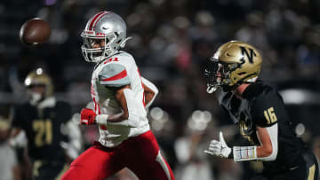 against Noblesville Millers cornerback Cole Schott (16) on Friday, Sept. 1, 2023, during the game at Noblesville High School in Noblesville. The Fishers Tigers defeated the Noblesville Millers, 48-22.