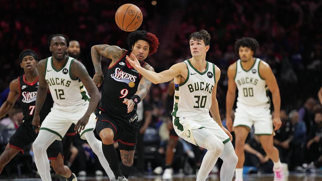 Apr 12, 2026; Philadelphia, Pennsylvania, USA; Milwaukee Bucks guard Cormac Ryan (30) reaches for the ball against Philadelphia 76ers guard Kelly Oubre Jr (9) in the third quarter at Xfinity Mobile Arena. Mandatory Credit: Kyle Ross-Imagn Images