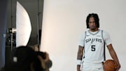 Sep 29, 2025; San Antonio, TX, USA; San Antonio Spurs guard Stephon Castle (5) poses for photos during Media Day at Victory Capital Performance Center in San Antonio. Mandatory Credit: Scott Wachter-Imagn Images