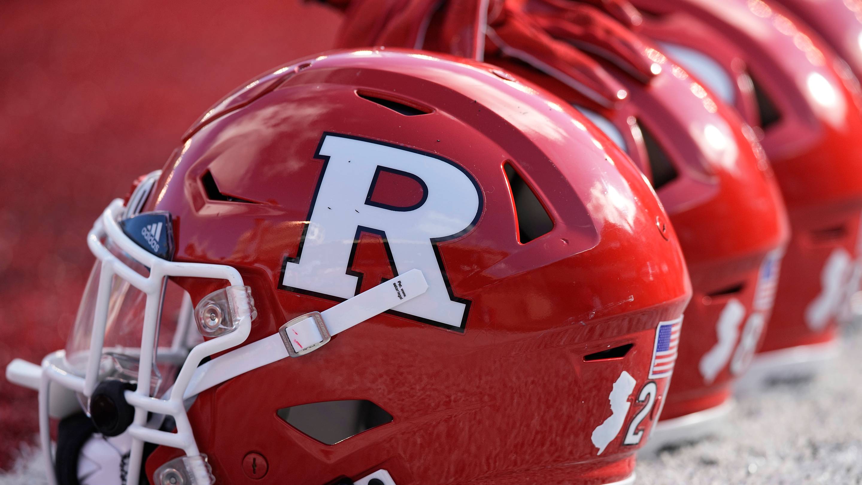 Oct 7, 2023; Madison, Wisconsin, USA; Rutgers Scarlet Knights football helmets sit on the field during warmups prior to the game against the Wisconsin Badgers at Camp Randall Stadium. Mandatory Credit: Jeff Hanisch-USA TODAY Sports