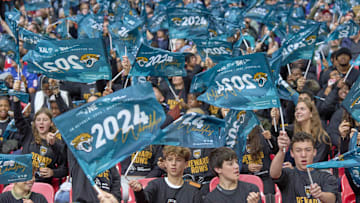 Oct 20, 2024; London, United Kingdom; Fans and flags in the first half during an NFL International Series game at Wembley Stadium. Mandatory Credit: Peter van den Berg-Imagn Images