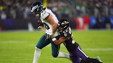 Dec 1, 2024; Baltimore, Maryland, USA; Philadelphia Eagles tight end Dallas Goedert (88) gains yardage after a third quarter catch defended by Baltimore Ravens safety Ar’Darius Washington (29) at M&T Bank Stadium. Mandatory Credit: Mitch Stringer-Imagn Images