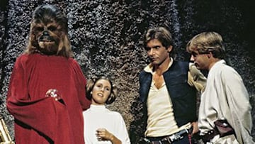 (L to r) R2-D2, Anthony Daniels as C-3PO, Peter Mayhew as Chewbacca, Carrie Fisher as Princess Leia, Harrison Ford as Han Solo, and Mark Hamill as Luke Skywalker in the Star Wars Holiday Special