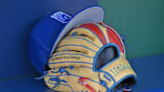 Aug 12, 2023; Kansas City, Missouri, USA;  Detailed view of a Kansas City Royals hat and glove before a game  against the St. Louis Cardinals at Kauffman Stadium. Mandatory Credit: Peter Aiken-Imagn Images