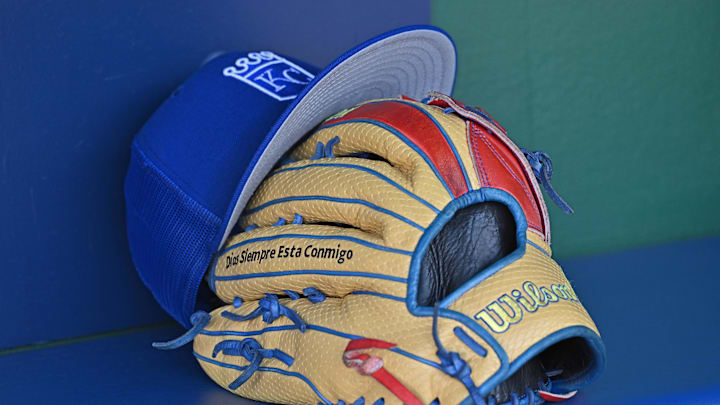 Aug 12, 2023; Kansas City, Missouri, USA;  Detailed view of a Kansas City Royals hat and glove before a game  against the St. Louis Cardinals at Kauffman Stadium. Mandatory Credit: Peter Aiken-Imagn Images