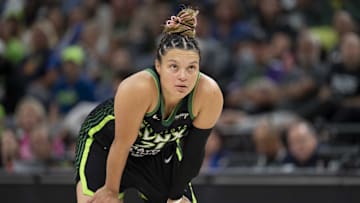Sep 21, 2025; Minneapolis, Minnesota, USA; Minnesota Lynx guard Kayla McBride (21) looks on against the Phoenix Mercury in the second half during game one of the second round for the 2025 WNBA Playoffs at Target Center. Mandatory Credit: Jesse Johnson-Imagn Images