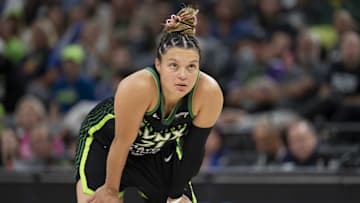 Sep 21, 2025; Minneapolis, Minnesota, USA; Minnesota Lynx guard Kayla McBride (21) looks on against the Phoenix Mercury in the second half during game one of the second round for the 2025 WNBA Playoffs at Target Center. Mandatory Credit: Jesse Johnson-Imagn Images