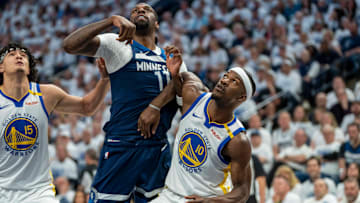 Minnesota Timberwolves center Naz Reid and Golden State Warriors forward Jimmy Butler III (10) fight for position during a free throw in the first half during Game 2 of their Western Conference semifinal at Target Center in Minneapolis on May 8, 2025.
