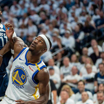 Minnesota Timberwolves center Naz Reid and Golden State Warriors forward Jimmy Butler III (10) fight for position during a free throw in the first half during Game 2 of their Western Conference semifinal at Target Center in Minneapolis on May 8, 2025.