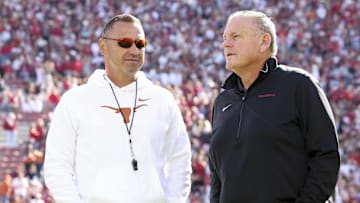 Nov 16, 2024; Fayetteville, Arkansas, USA; Texas Longhorns head coach Steve Sarkisian and Arkansas Razorbacks head coach Sam Pittman interact prior to the game at Donald W. Reynolds Razorback Stadium. Mandatory Credit: Nelson Chenault-Imagn Images