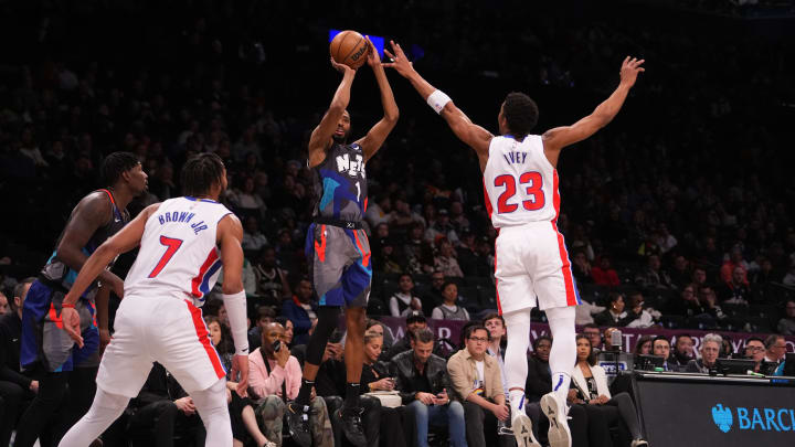 Apr 6, 2024; Brooklyn, New York, USA; Brooklyn Nets small forward Mikal Bridges (1) shoots a three-point jump shot against Detroit Pistons point guard Jaden Ivey (23) during the second half at Barclays Center. Mandatory Credit: Gregory Fisher-USA TODAY Sports