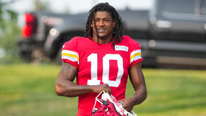 Jul 26, 2024; Kansas City, MO, USA; Kansas City Chiefs running back Isiah Pacheco (10) smiles at fans while walking down the hill from the locker room to the fields prior to training camp at Missouri Western State University. Mandatory Credit: Denny Medley-USA TODAY Sports